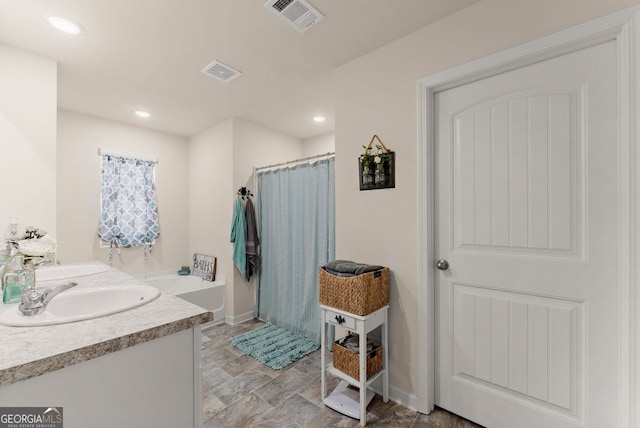 352 Walnut Grove Way, Pendergrass, GA 30567 - full bathroom with a shower with curtain, stone finish floors, baseboards, recessed lighting, and double vanity