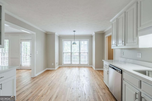 5611 Manassas Run, Stone Mountain, GA 30087 - kitchen featuring light countertops, baseboards, light wood-style flooring, and dishwasher