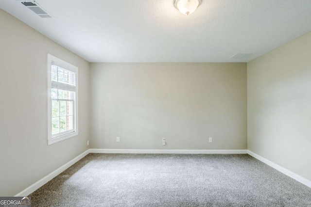 5611 Manassas Run, Stone Mountain, GA 30087 - carpeted empty room featuring baseboards and visible vents