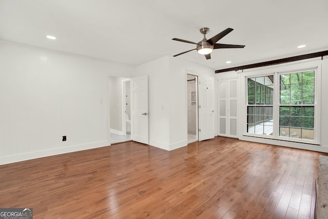 interior space featuring wood-type flooring, recessed lighting, baseboards, and a ceiling fan