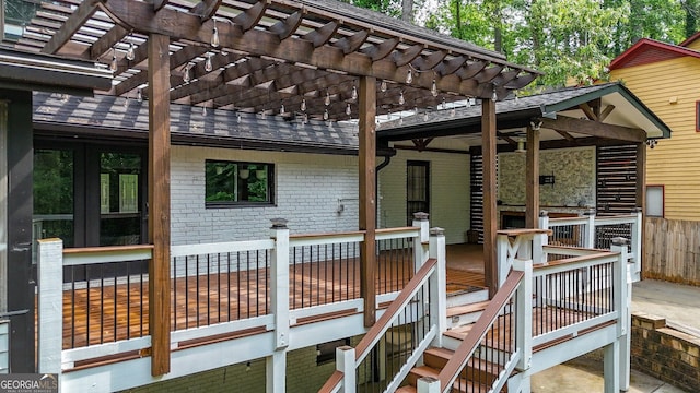 wooden terrace with french doors and a pergola