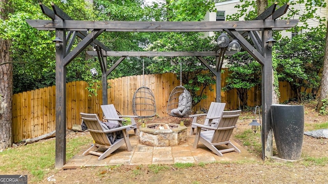 view of patio / terrace featuring a fire pit, fence, and a pergola