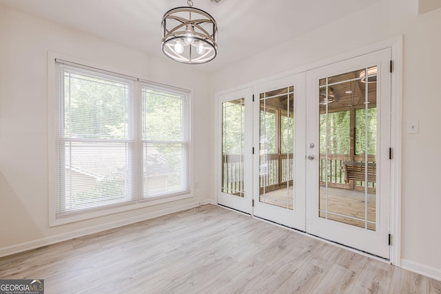 9985 Lake Forest Way, Roswell, GA 30076 - doorway to outside with plenty of natural light, french doors, light wood-style flooring, and a chandelier