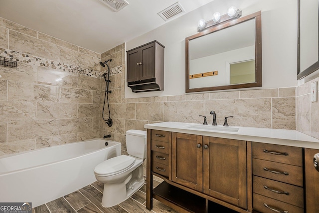 9985 Lake Forest Way, Roswell, GA 30076 - full bathroom featuring toilet, visible vents, tile walls, and vanity