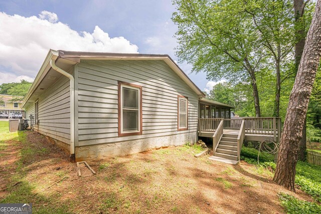 9985 Lake Forest Way, Roswell, GA 30076 - view of side of property with a deck, stairs, and a sunroom