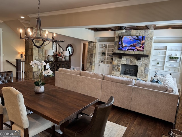 2220 Cambridge Hill Ct, Dacula, GA 30019 - dining space with a chandelier, a fireplace, ornamental molding, dark wood-type flooring, and recessed lighting