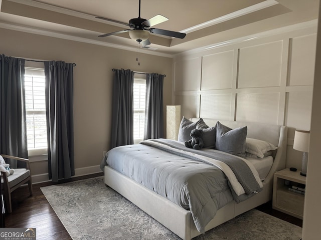 2220 Cambridge Hill Ct, Dacula, GA 30019 - bedroom with a raised ceiling, crown molding, wood finished floors, a decorative wall, and ceiling fan