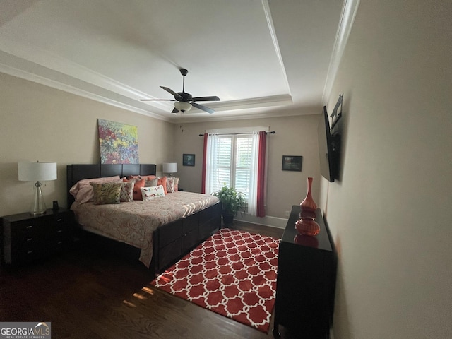 2220 Cambridge Hill Ct, Dacula, GA 30019 - bedroom featuring wood finished floors, a raised ceiling, a ceiling fan, and ornamental molding