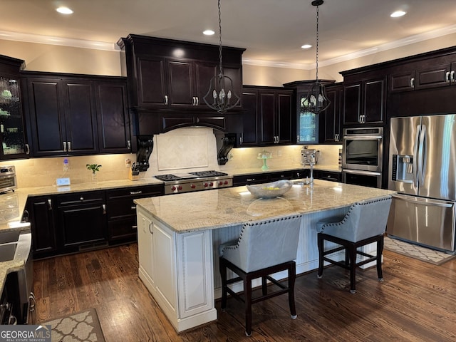 2220 Cambridge Hill Ct, Dacula, GA 30019 - kitchen featuring appliances with stainless steel finishes, a chandelier, crown molding, light stone countertops, and backsplash