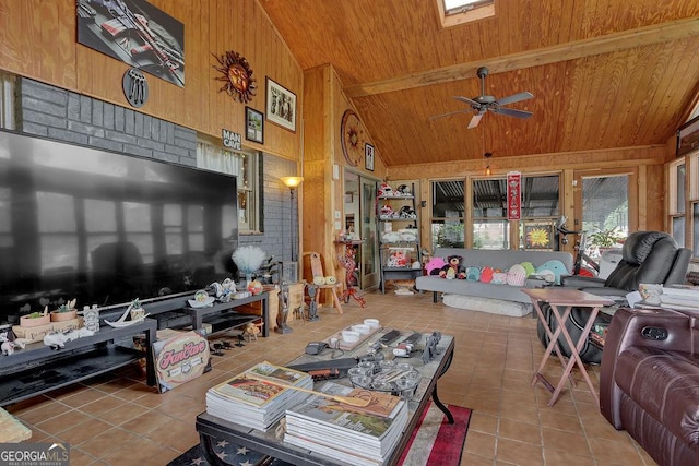 interior space featuring tile patterned flooring, wood walls, high vaulted ceiling, wood ceiling, and a ceiling fan