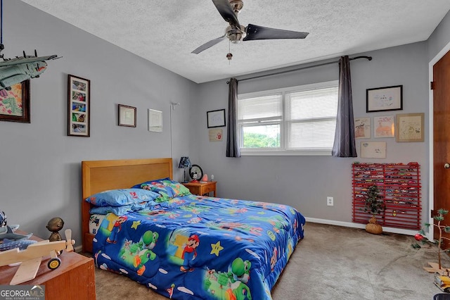 bedroom with a ceiling fan, a textured ceiling, baseboards, and carpet