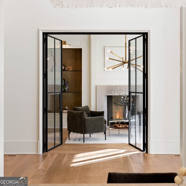 490 Mount Paran Rd, Atlanta, GA 30327 - sitting room with wood finished floors and a chandelier