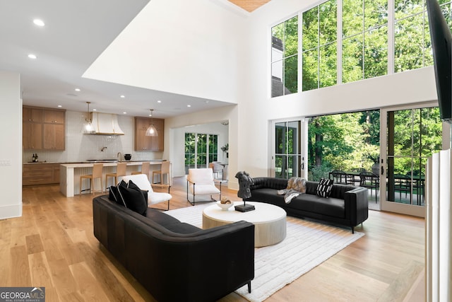 490 Mount Paran Rd, Atlanta, GA 30327 - living room with light wood finished floors, recessed lighting, and a towering ceiling