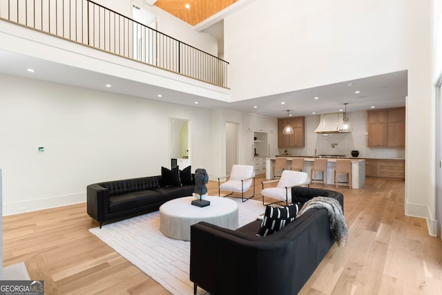 490 Mount Paran Rd, Atlanta, GA 30327 - living room with a towering ceiling, light wood finished floors, recessed lighting, and baseboards