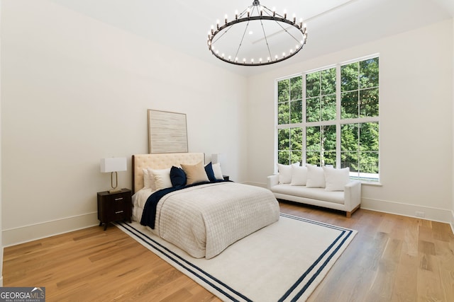 490 Mount Paran Rd, Atlanta, GA 30327 - bedroom featuring a chandelier, baseboards, and wood finished floors