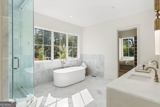490 Mount Paran Rd, Atlanta, GA 30327 - bathroom featuring a freestanding tub, double vanity, a marble finish shower, tile walls, and recessed lighting