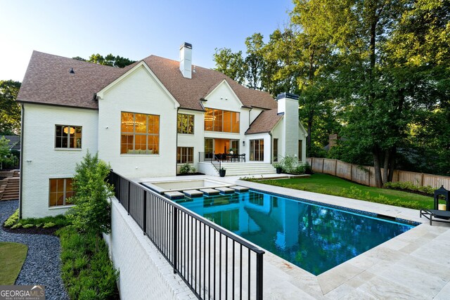 490 Mount Paran Rd, Atlanta, GA 30327 - rear view of property featuring a chimney, roof with shingles, a fenced backyard, and a patio