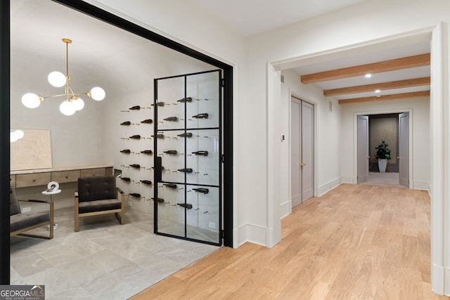 490 Mount Paran Rd, Atlanta, GA 30327 - wine room with beamed ceiling, wood finished floors, a chandelier, and baseboards