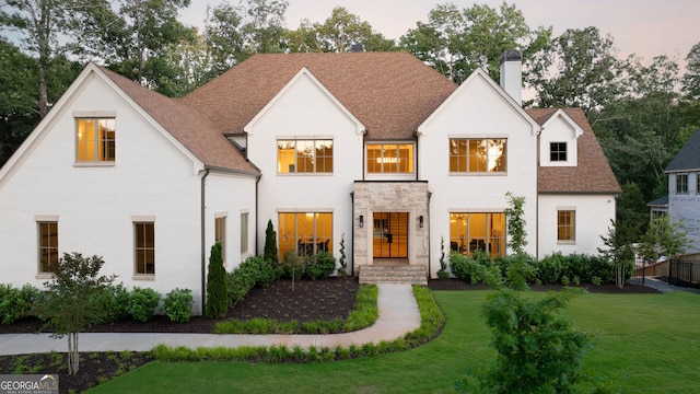 490 Mount Paran Rd, Atlanta, GA 30327 - view of front facade featuring a chimney, a front yard, roof with shingles, and stone siding