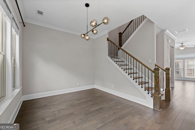 interior space featuring crown molding, dark wood-style flooring, stairs, and visible vents