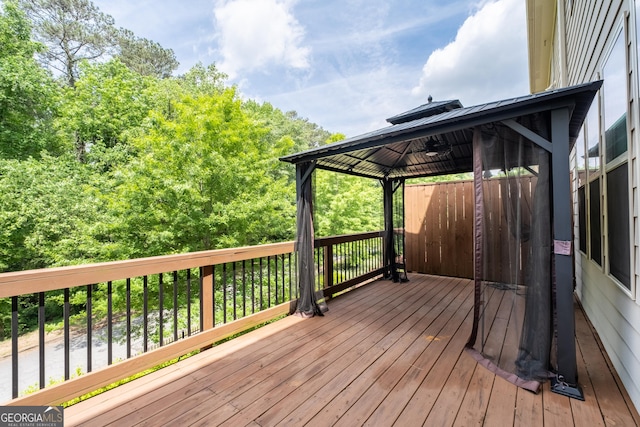 wooden deck featuring a gazebo