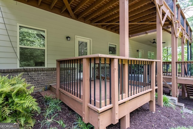 wooden terrace featuring a ceiling fan