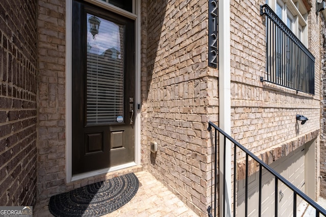 property entrance with brick siding