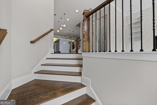 staircase featuring recessed lighting