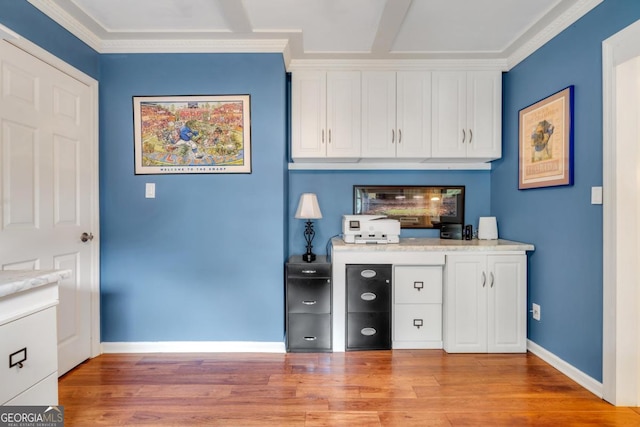 bar featuring baseboards, ornamental molding, and light wood-type flooring