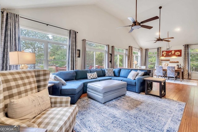 living area with high vaulted ceiling, a ceiling fan, recessed lighting, and hardwood / wood-style floors