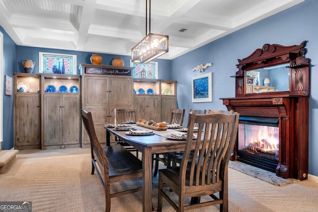 dining space featuring light colored carpet, coffered ceiling, and beamed ceiling