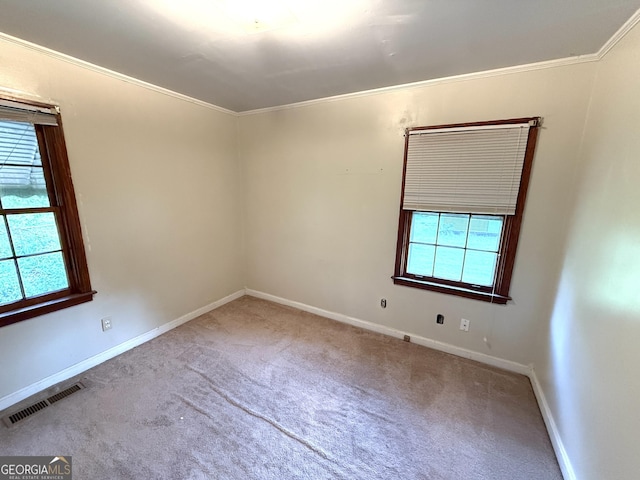 empty room with baseboards, carpet flooring, and visible vents