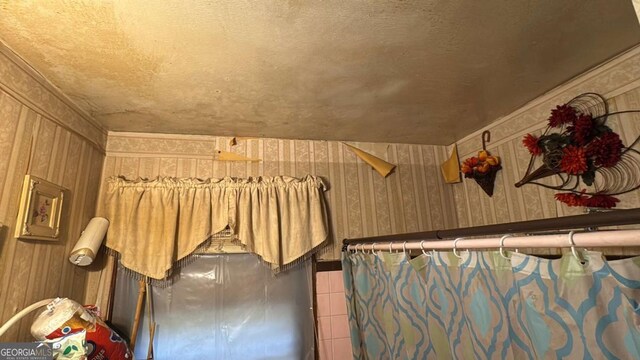 interior space featuring wallpapered walls