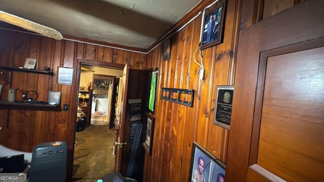 corridor featuring wooden walls