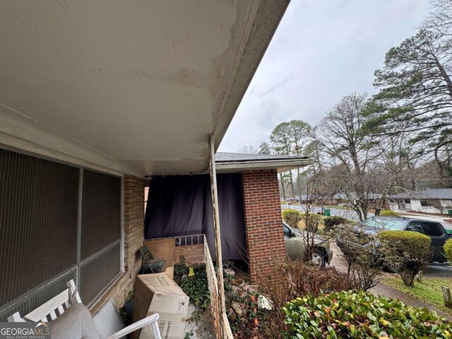 exterior space featuring brick siding