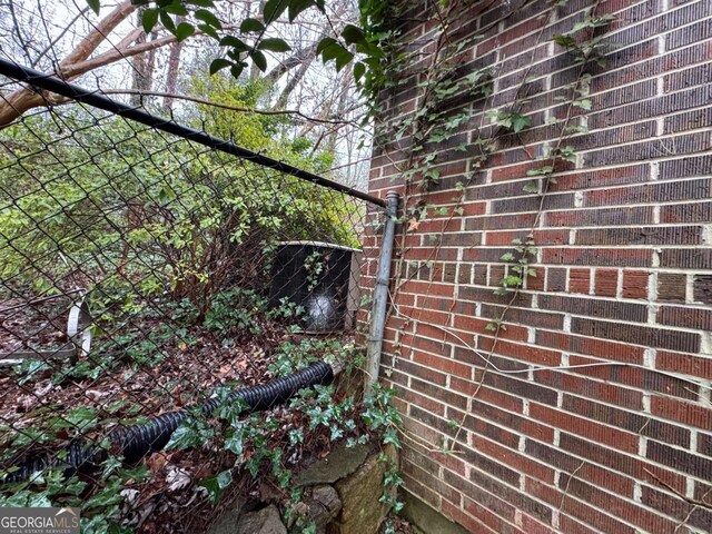 exterior details featuring brick siding