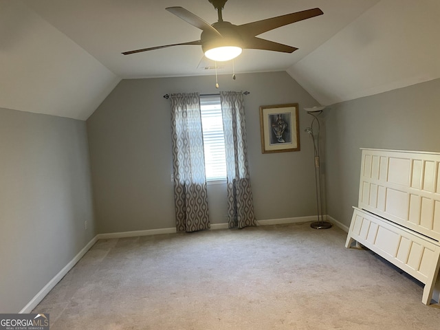 bonus room with baseboards, ceiling fan, vaulted ceiling, and carpet flooring