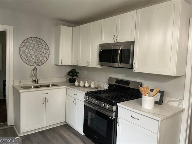 2135 Niskey Lake Rd, Atlanta, GA 30331 - kitchen featuring stainless steel appliances, dark wood-style floors, and white cabinetry