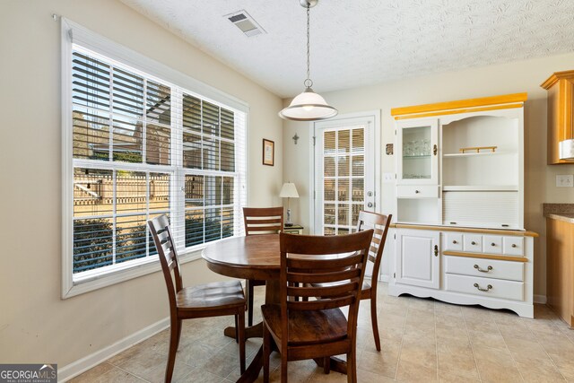 17 Castleview Ct, Jefferson, GA 30549 - dining area featuring visible vents, plenty of natural light, and light tile patterned floors