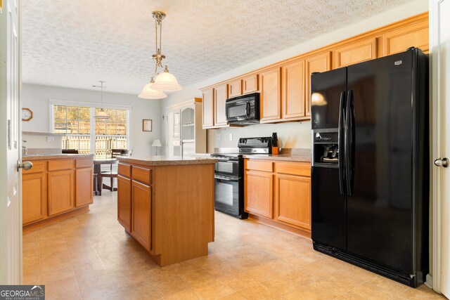 17 Castleview Ct, Jefferson, GA 30549 - kitchen with a kitchen island, a textured ceiling, decorative light fixtures, light countertops, and black appliances