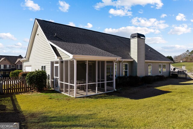 17 Castleview Ct, Jefferson, GA 30549 - back of property featuring fence, a lawn, a sunroom, and roof with shingles