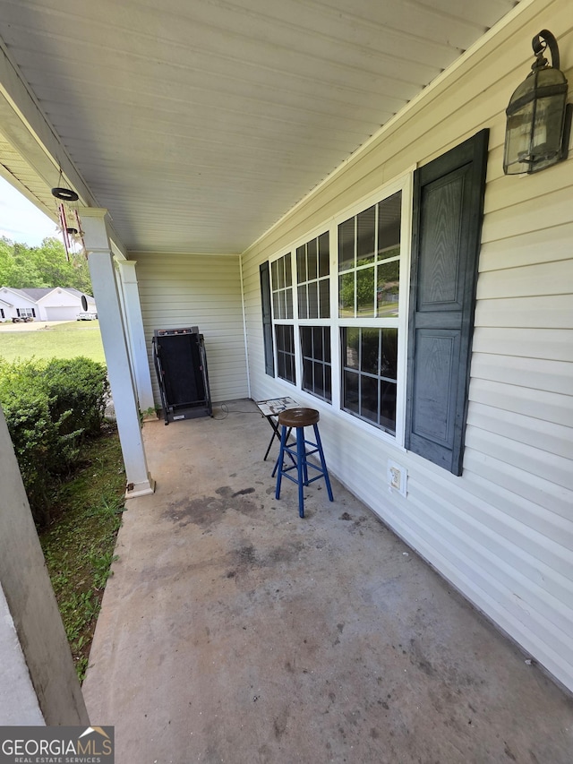 view of patio featuring a porch