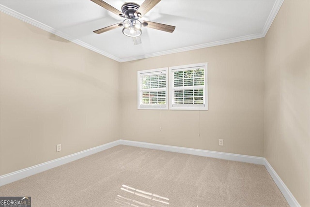empty room featuring crown molding, ceiling fan, light carpet, and baseboards