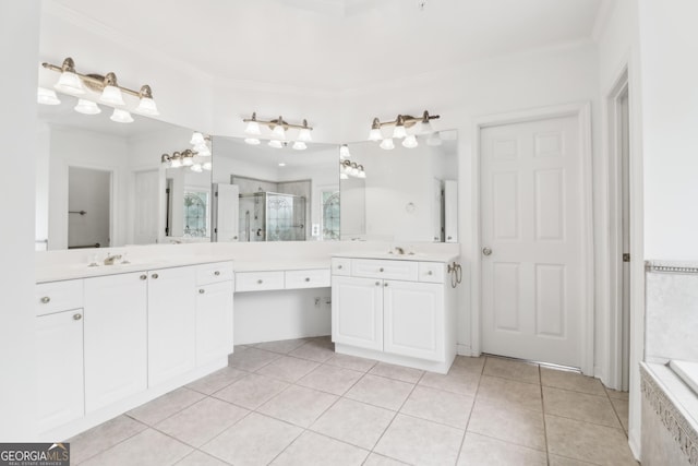 bathroom featuring crown molding, a sink, tile patterned flooring, two vanities, and a shower stall