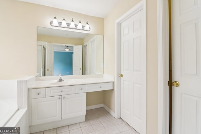 bathroom featuring a garden tub, an enclosed shower, tile patterned flooring, vanity, and baseboards