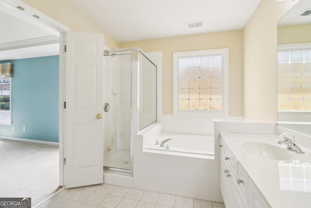 full bathroom with a shower stall, a bath, and visible vents