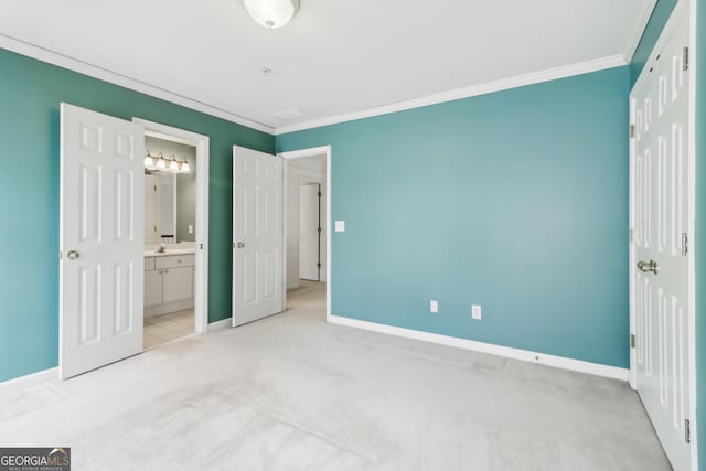 unfurnished bedroom with carpet floors, ornamental molding, and baseboards