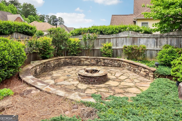view of patio / terrace featuring a fire pit and a fenced backyard