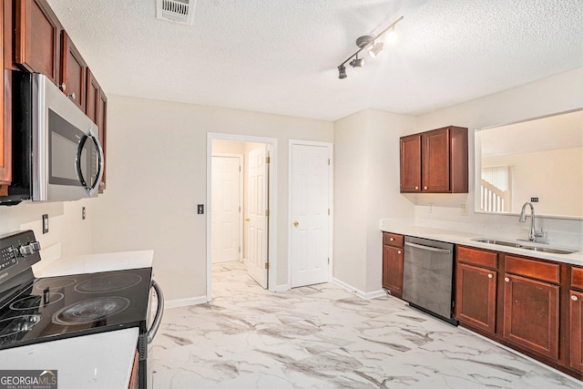 4795 Wilkins Station Dr, Decatur, GA 30035 - kitchen featuring a textured ceiling, visible vents, appliances with stainless steel finishes, a sink, and marble finish floor