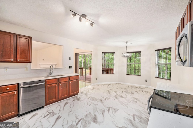 4795 Wilkins Station Dr, Decatur, GA 30035 - kitchen featuring light countertops, stainless steel appliances, a wealth of natural light, and a sink